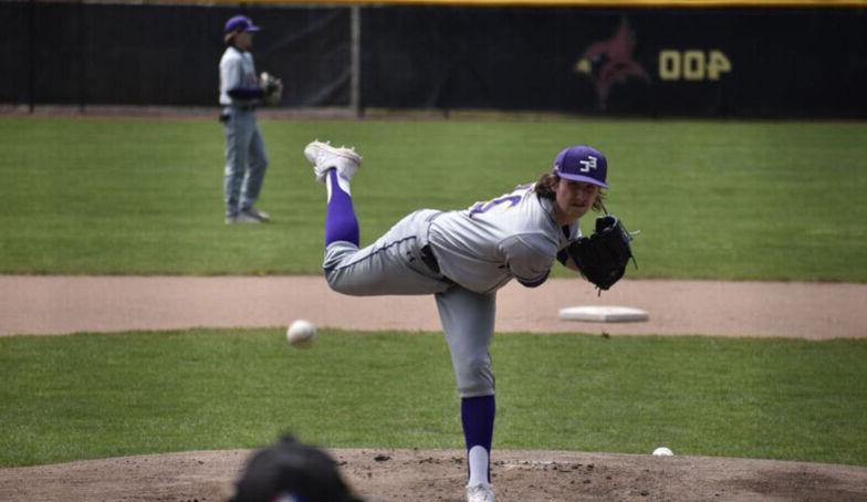 A pitcher throws a pitch to a batter